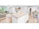 Open-concept kitchen featuring granite countertops, stainless appliances, and island overlooking the living area at 115 Crownpiece St, Troutman, NC 28166