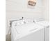 Bright laundry room featuring a modern washer and dryer set at 115 Crownpiece St, Troutman, NC 28166