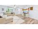 Inviting living room with comfortable seating, hardwood floors, and a decorative entertainment center at 115 Crownpiece St, Troutman, NC 28166