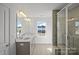 Elegant bathroom boasts a double vanity, large mirror, and a glass-enclosed shower at 14028 Parkside Crossing Dr # 331, Charlotte, NC 28273