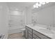 Bathroom featuring double sink vanity, neutral walls, and shower/tub combo at 14028 Parkside Crossing Dr # 331, Charlotte, NC 28273
