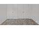 Neutral bedroom showcasing carpet flooring and bright white doors at 14028 Parkside Crossing Dr # 331, Charlotte, NC 28273