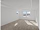 Bright bedroom features plush carpeting, recessed lighting, and a window with neighborhood views at 14028 Parkside Crossing Dr # 331, Charlotte, NC 28273