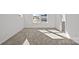 Well-lit bedroom with neutral carpeting, large windows, and ample natural light at 14028 Parkside Crossing Dr # 331, Charlotte, NC 28273