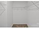 Organized walk-in closet features wire shelving for efficient storage at 14028 Parkside Crossing Dr # 331, Charlotte, NC 28273