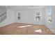 Bright and airy living room area with hardwood floors and large windows at 14028 Parkside Crossing Dr # 331, Charlotte, NC 28273