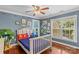 A bedroom with a hardwood floor, blue walls, and plenty of natural light at 141 Ridge Top Rd, Mooresville, NC 28117