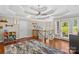 Bonus room features hardwood floors, ceiling fan, access to the balcony, and space for work or play at 141 Ridge Top Rd, Mooresville, NC 28117