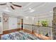 Upper level landing featuring a chandelier, hardwood floors, and a decorative area rug at 141 Ridge Top Rd, Mooresville, NC 28117