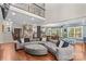 Bright and spacious living room with hardwood floors and an open layout connecting to the kitchen and dining area at 141 Ridge Top Rd, Mooresville, NC 28117
