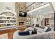 Grand living room with a stone fireplace, built-in shelves, and an open floor plan, perfect for gatherings at 141 Ridge Top Rd, Mooresville, NC 28117