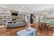 Open concept living space with fireplace, dining area, play area, and modern kitchen with stainless appliances at 141 Ridge Top Rd, Mooresville, NC 28117