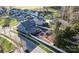 Aerial view of a neighborhood with a lush backyard, a stone fire pit, and decorative landscaping at 1502 Matthew Mcclure Cir, Davidson, NC 28036