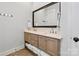 Well-lit bathroom with double vanity, stylish fixtures, and tile flooring at 1502 Matthew Mcclure Cir, Davidson, NC 28036