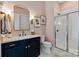 Stylish bathroom with modern vanity, mirror, and glass shower at 1502 Matthew Mcclure Cir, Davidson, NC 28036