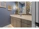 Stylish bathroom with colorful wallpaper, modern vanity, framed mirror, and updated fixtures at 1502 Matthew Mcclure Cir, Davidson, NC 28036