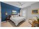 Cozy bedroom with an accent wall, a plush bed, and decorative lighting for a relaxing and inviting space at 1502 Matthew Mcclure Cir, Davidson, NC 28036