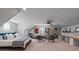 Spacious bedroom features a bed, sitting area, and large bookshelf, blending relaxation and functionality at 1502 Matthew Mcclure Cir, Davidson, NC 28036