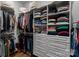 Organized walk-in closet with custom shelving, drawers, and ample storage space at 1502 Matthew Mcclure Cir, Davidson, NC 28036