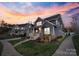 Charming exterior showcasing a covered porch and lush landscaping in a peaceful neighborhood at 1502 Matthew Mcclure Cir, Davidson, NC 28036