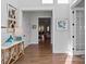 Bright foyer features hardwood floors, modern decor, and an open view into the living spaces at 1502 Matthew Mcclure Cir, Davidson, NC 28036