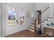 Bright foyer with hardwood floors, staircase, and double front doors at 1502 Matthew Mcclure Cir, Davidson, NC 28036