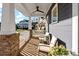 Relaxing front porch with ceiling fan, comfortable seating, and a view of the neighborhood at 1502 Matthew Mcclure Cir, Davidson, NC 28036