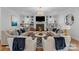 Beautiful living room featuring built-in shelving, a fireplace, and stylish furnishings at 1502 Matthew Mcclure Cir, Davidson, NC 28036