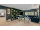 Large living room with custom built-ins, comfortable seating, and lots of natural light, perfect for entertaining at 1502 Matthew Mcclure Cir, Davidson, NC 28036