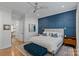 Stylish bedroom with a blue accent wall and designer decor at 1502 Matthew Mcclure Cir, Davidson, NC 28036