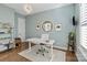 Stylish home office with a modern desk, shelving, and natural light at 1502 Matthew Mcclure Cir, Davidson, NC 28036