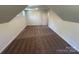 Spacious finished attic featuring carpeted floors, neutral walls, and dormer windows for natural light at 1563 Riverview Cir, Fort Lawn, SC 29714