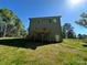 New home with a backyard deck and a walkout basement with green lawn at 1563 Riverview Cir, Fort Lawn, SC 29714