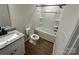 Modern bathroom with granite countertop, white cabinets, and tub at 1563 Riverview Cir, Fort Lawn, SC 29714