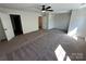 Spacious bedroom with neutral carpet and bright view to bathroom and closet at 1563 Riverview Cir, Fort Lawn, SC 29714