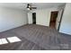 Spacious bedroom with neutral carpet and bright view to bathroom and closet at 1563 Riverview Cir, Fort Lawn, SC 29714