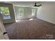 Spacious bedroom with neutral carpet, ceiling fan, and large bright windows at 1563 Riverview Cir, Fort Lawn, SC 29714