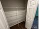 Organized walk-in closet with wire shelving offers ample storage space and carpeting at 1563 Riverview Cir, Fort Lawn, SC 29714
