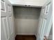 Bright walk-in closet with wood floor and ample storage space with open door at 1563 Riverview Cir, Fort Lawn, SC 29714