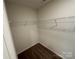 A white walk-in closet with shelving and carpet at 1563 Riverview Cir, Fort Lawn, SC 29714