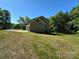 Exterior side of a two-story home with a green lawn and ample space at 1563 Riverview Cir, Fort Lawn, SC 29714