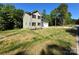 Charming two-story home with neutral siding, black shutters, and a well-manicured lawn at 1563 Riverview Cir, Fort Lawn, SC 29714