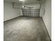 Clean garage features a modern overhead door, ample space, and concrete flooring at 1563 Riverview Cir, Fort Lawn, SC 29714