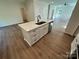 Kitchen island with quartz countertop, sink, stainless steel dishwasher, and white cabinetry at 1563 Riverview Cir, Fort Lawn, SC 29714