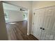 Bright living room with wood-look flooring, a ceiling fan, and natural light from the windows at 1563 Riverview Cir, Fort Lawn, SC 29714