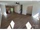 Open-concept living space with wood-look floors, recessed lighting, and easy access to the kitchen and stairs at 1563 Riverview Cir, Fort Lawn, SC 29714