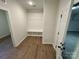 Hall tree mudroom area with bench and hooks, and luxury vinyl plank flooring at 1563 Riverview Cir, Fort Lawn, SC 29714