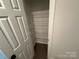 Walk-in pantry with white wire shelving for ample storage in a new home at 1563 Riverview Cir, Fort Lawn, SC 29714