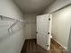 Walk-in closet with hanging rods and wire shelving at 1563 Riverview Cir, Fort Lawn, SC 29714