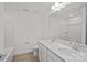 Contemporary bathroom with double sinks, quartz countertop, and modern fixtures at 15926 Parkside Crossing Dr # 322, Charlotte, NC 28273